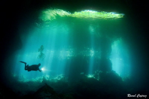 Through the light (Mexico cenote) by Raoul Caprez 